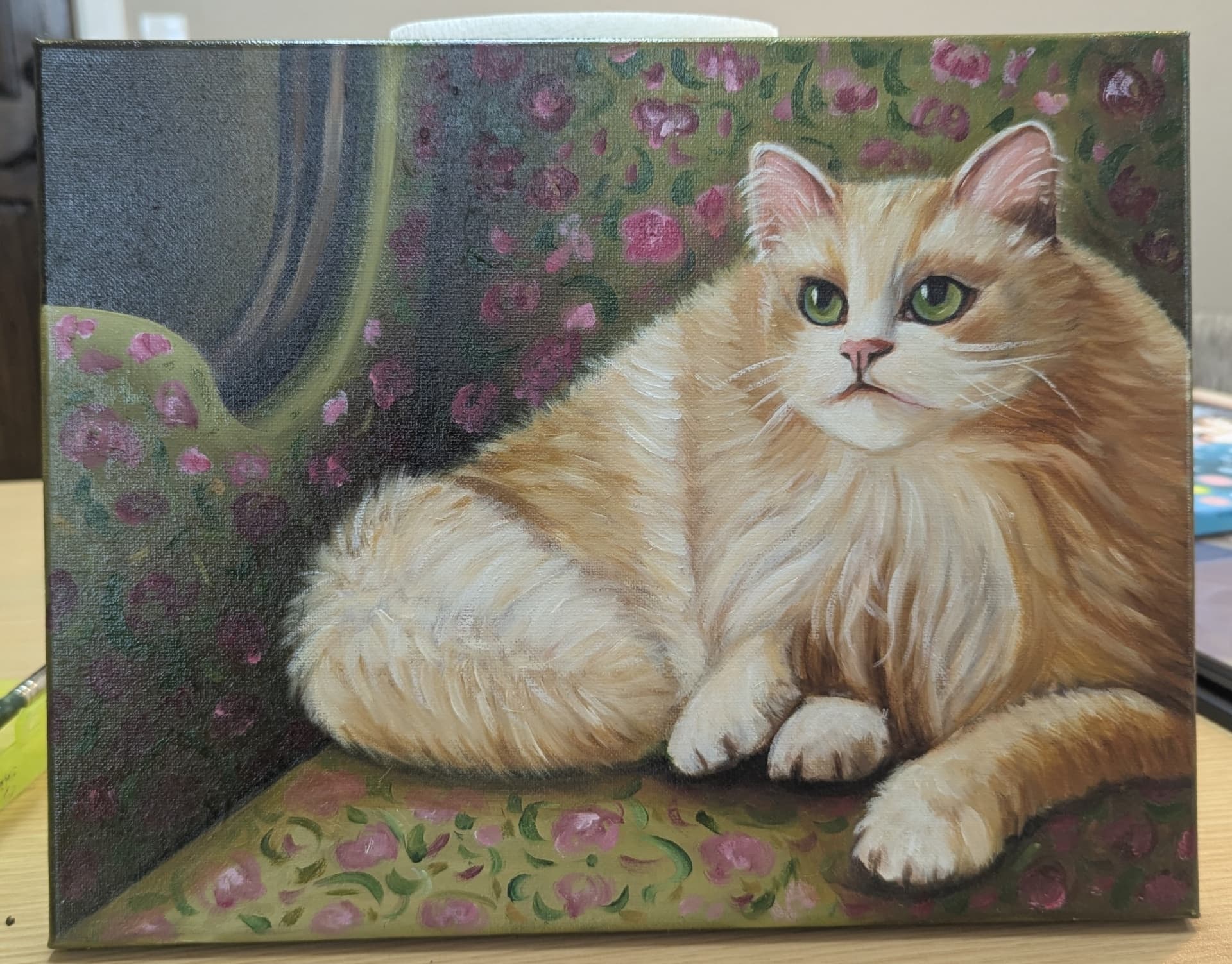 Oil painting of a fluffy cat with floral background by a student