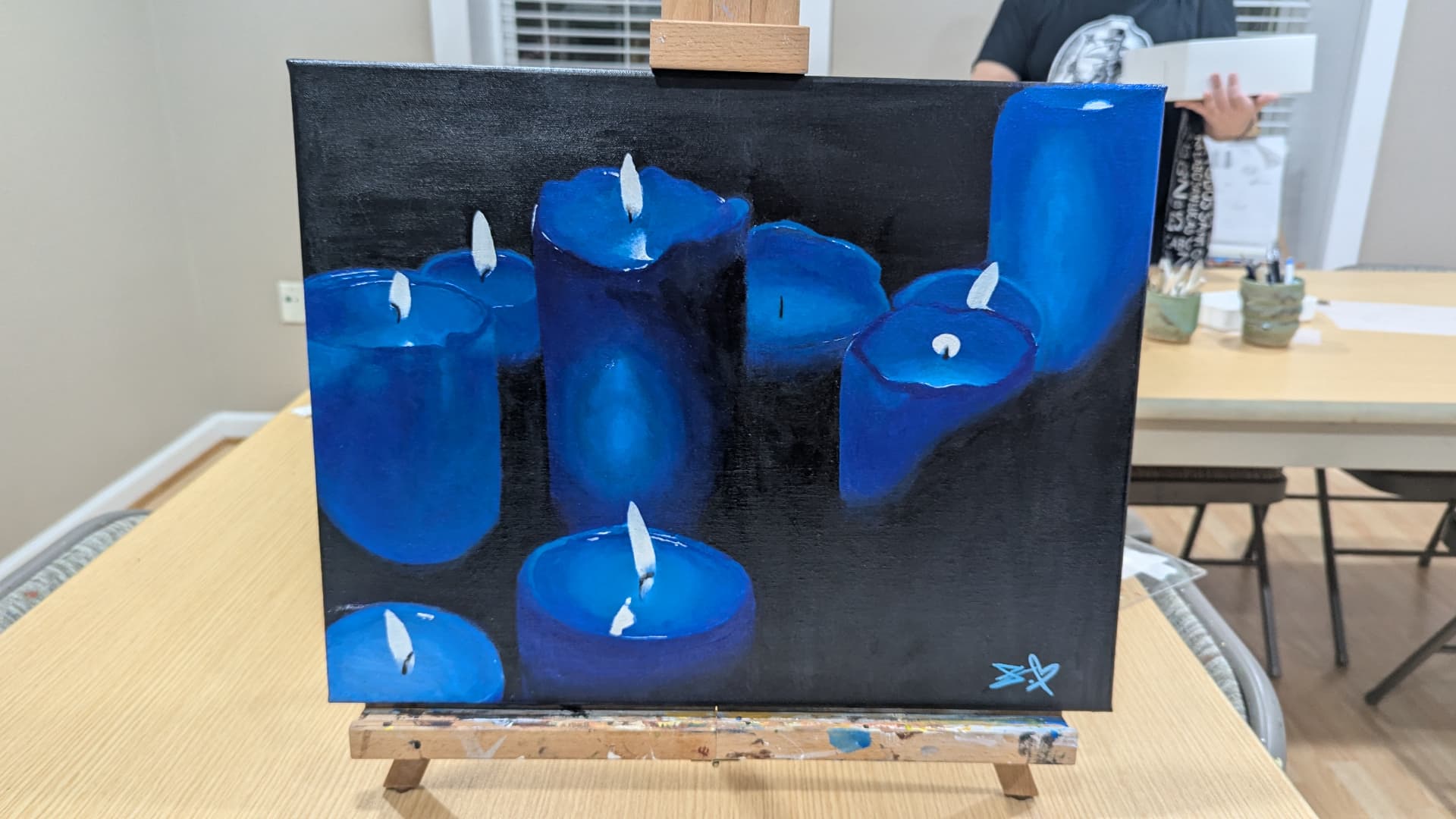 Teen acrylic painting of glowing blue candles