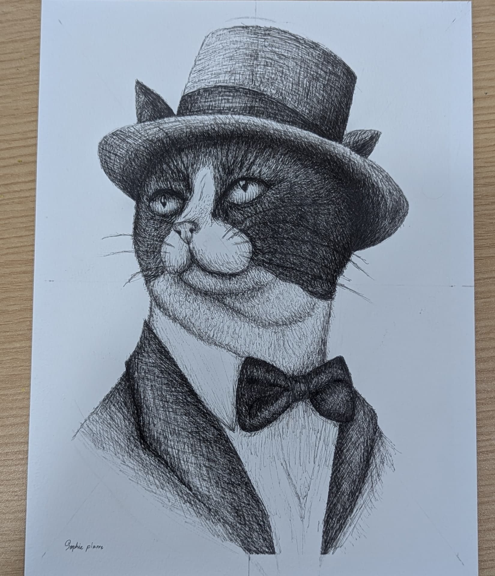 Ink drawing of a cat in a top hat and bowtie by a student