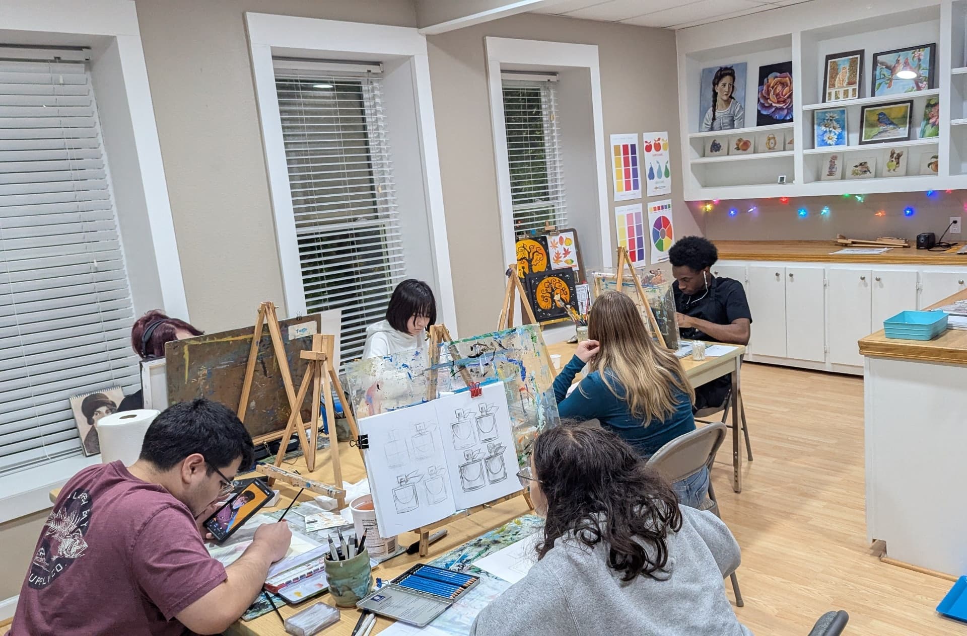 Teens painting together in the McKinney studio