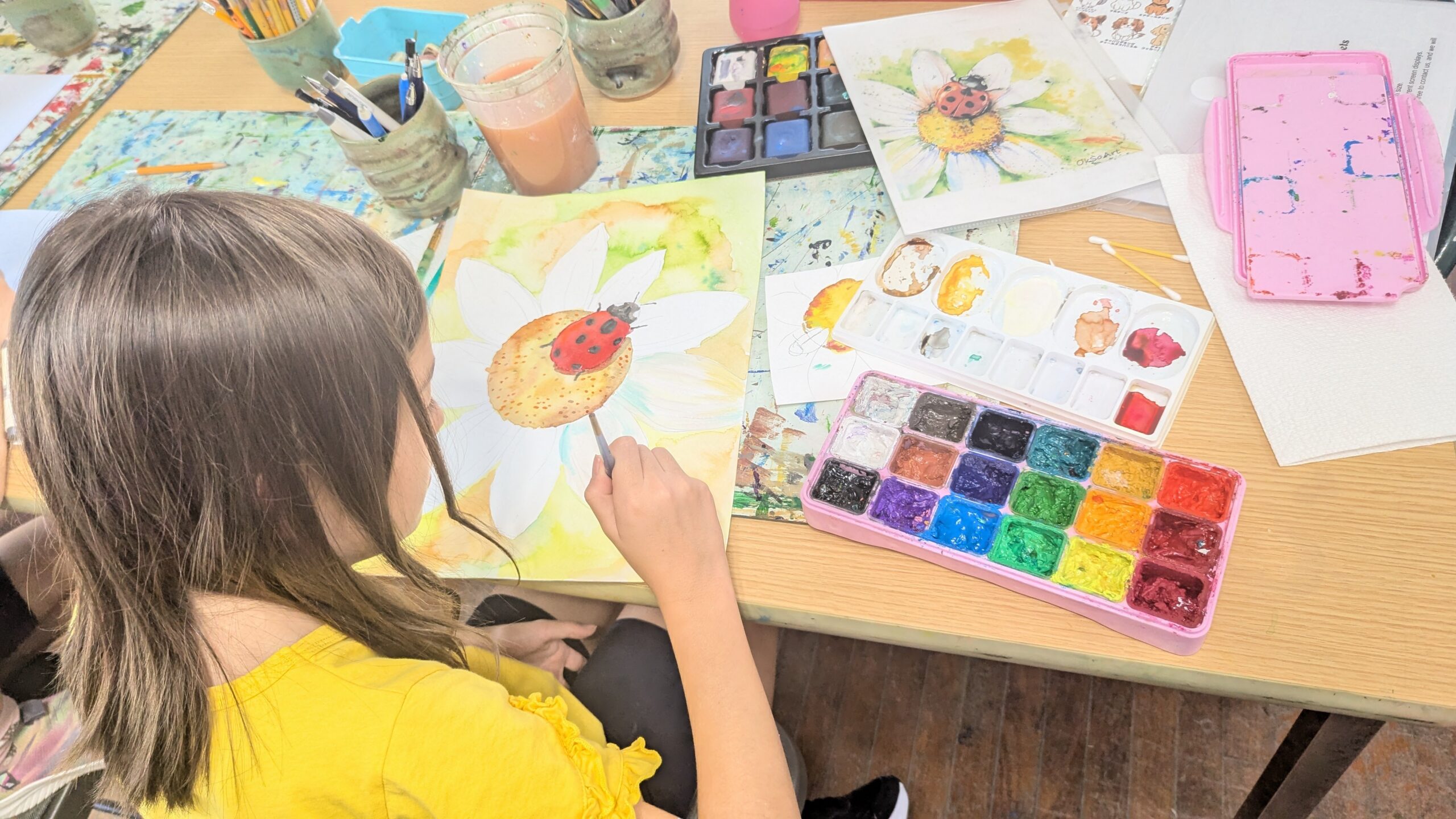 girl painting with watercolor